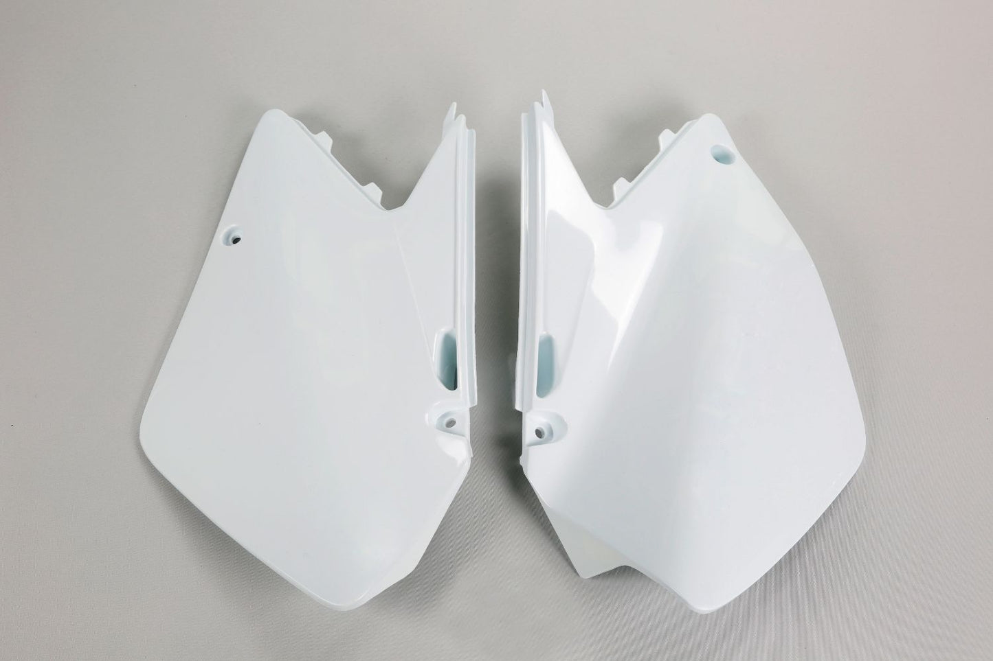 UFO Plast Fianchetti laterali portanumero Suzuki RM 125 2006-2012