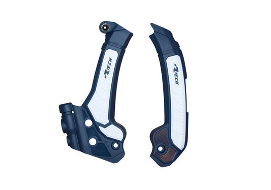 Racetech PROTEZIONE TELAIO BI-MATERIALE HUSQVARNA 125/150/250/300/350/450/501 2024-2026 BLU HUSQVARNA-BIANCO